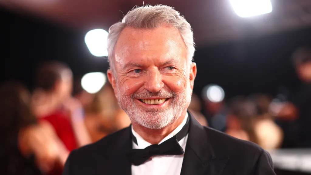 Sam Neill Remembered: Karl Urban & More Pay Tribute To “Beautiful Man”
